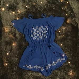 A stylish blue romper